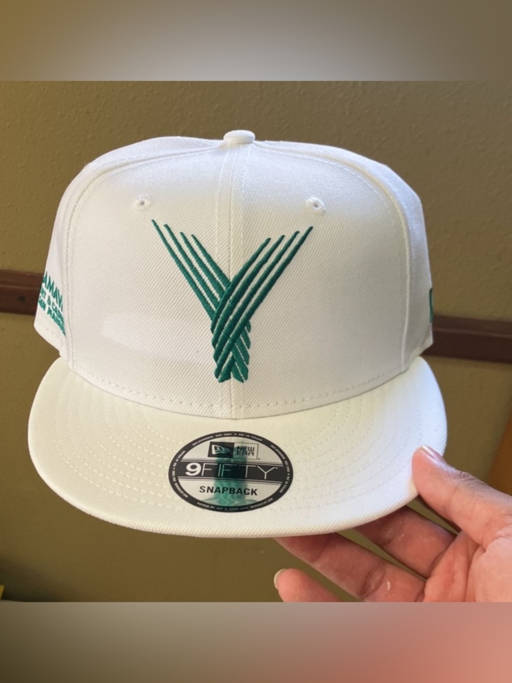 New Era White Cap with Green Embroidered 'Y' Logo snapback